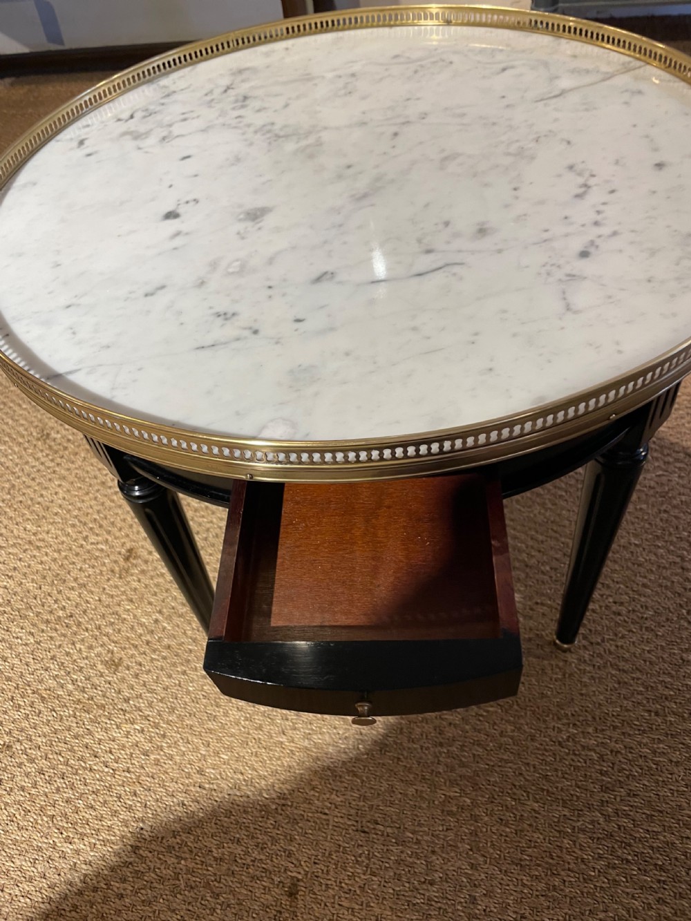Small round ebonised coffee table  View II