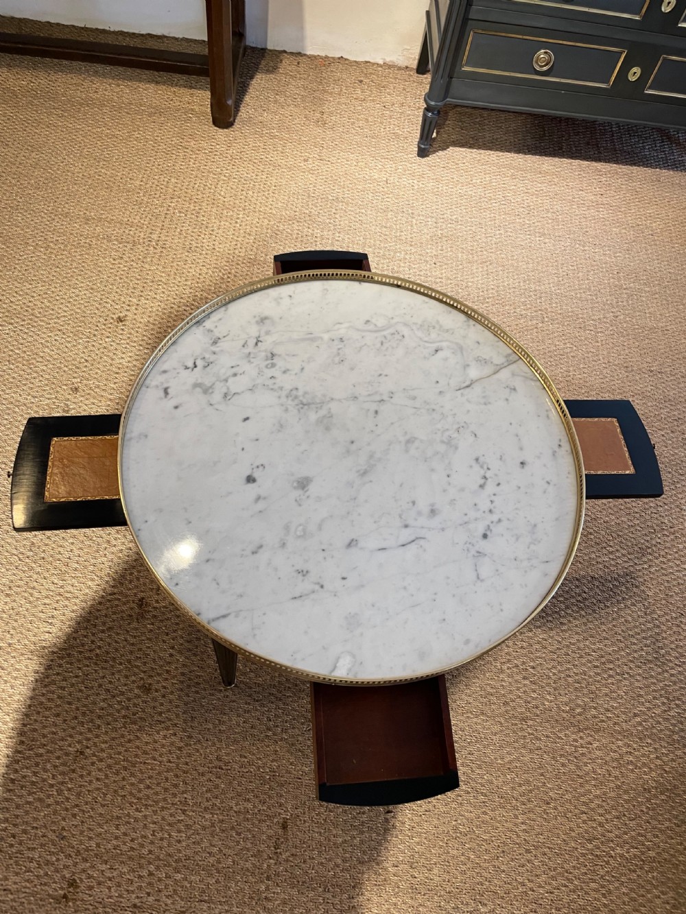Small round ebonised coffee table  View III