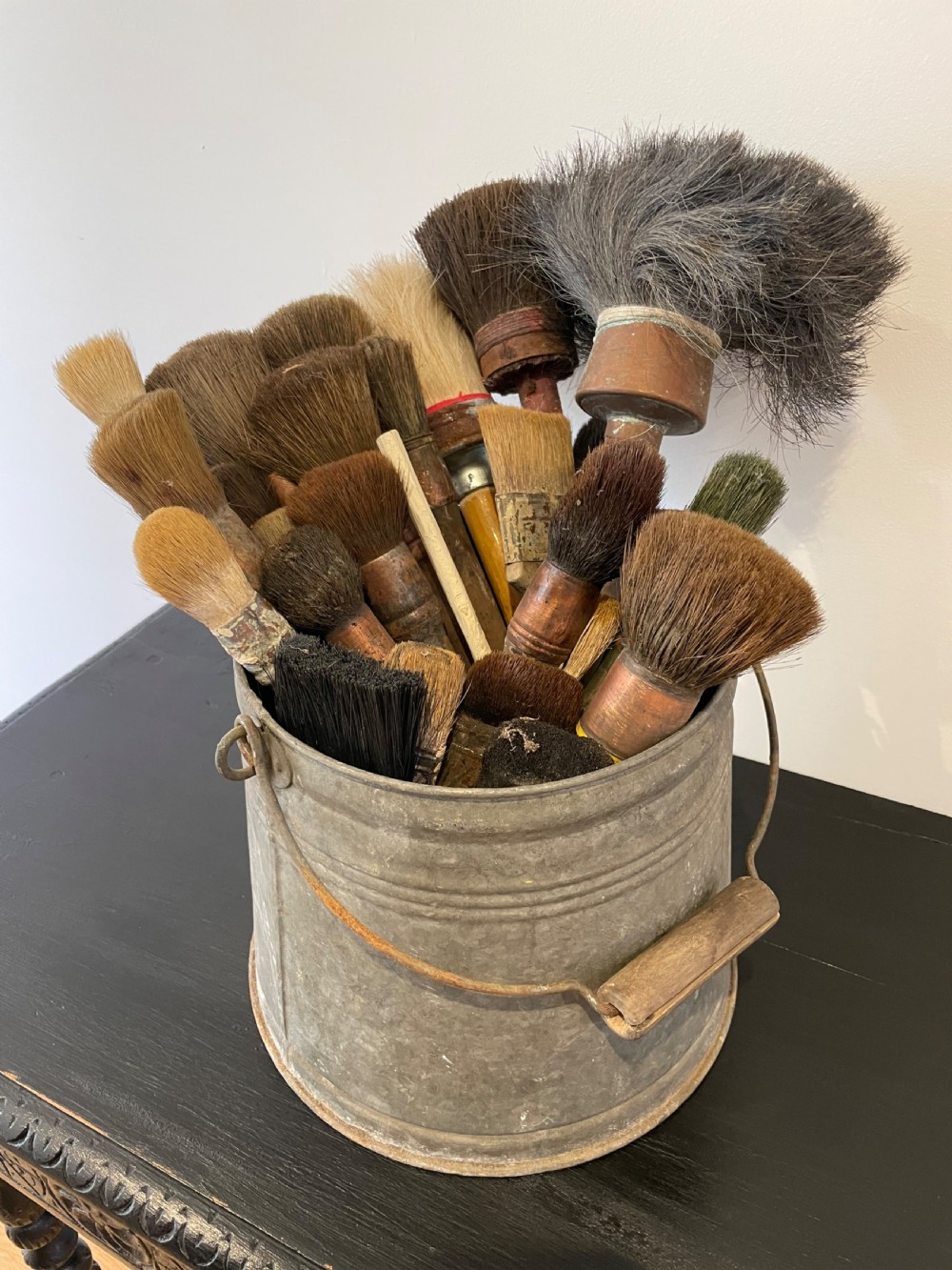 Collection of  paint brushes ina zinc bucket  View II