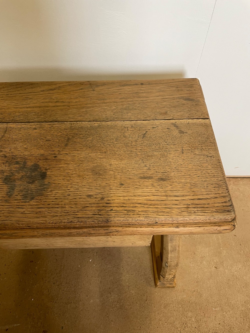 A Victorian oak window seat featuring arched Gothic Revival end legs, two frieze drawers, and a central turned stretcher. View VI