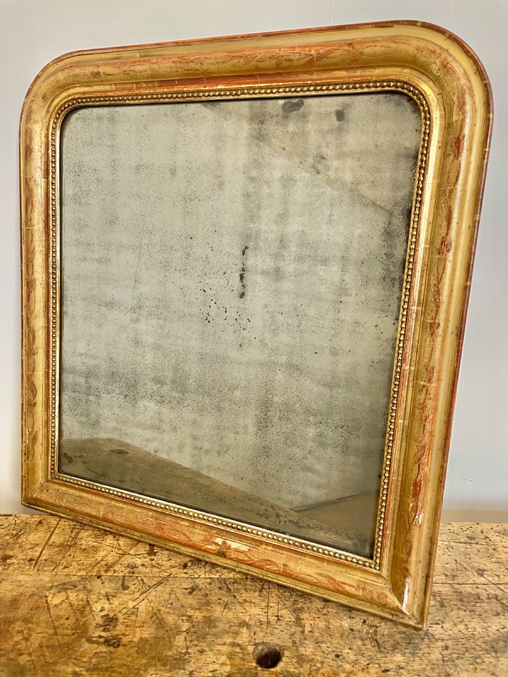 Antique gilt arched top mirror 