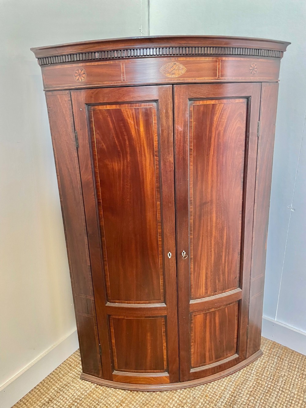 Georgian mahogany bow fronted corner cupboard 