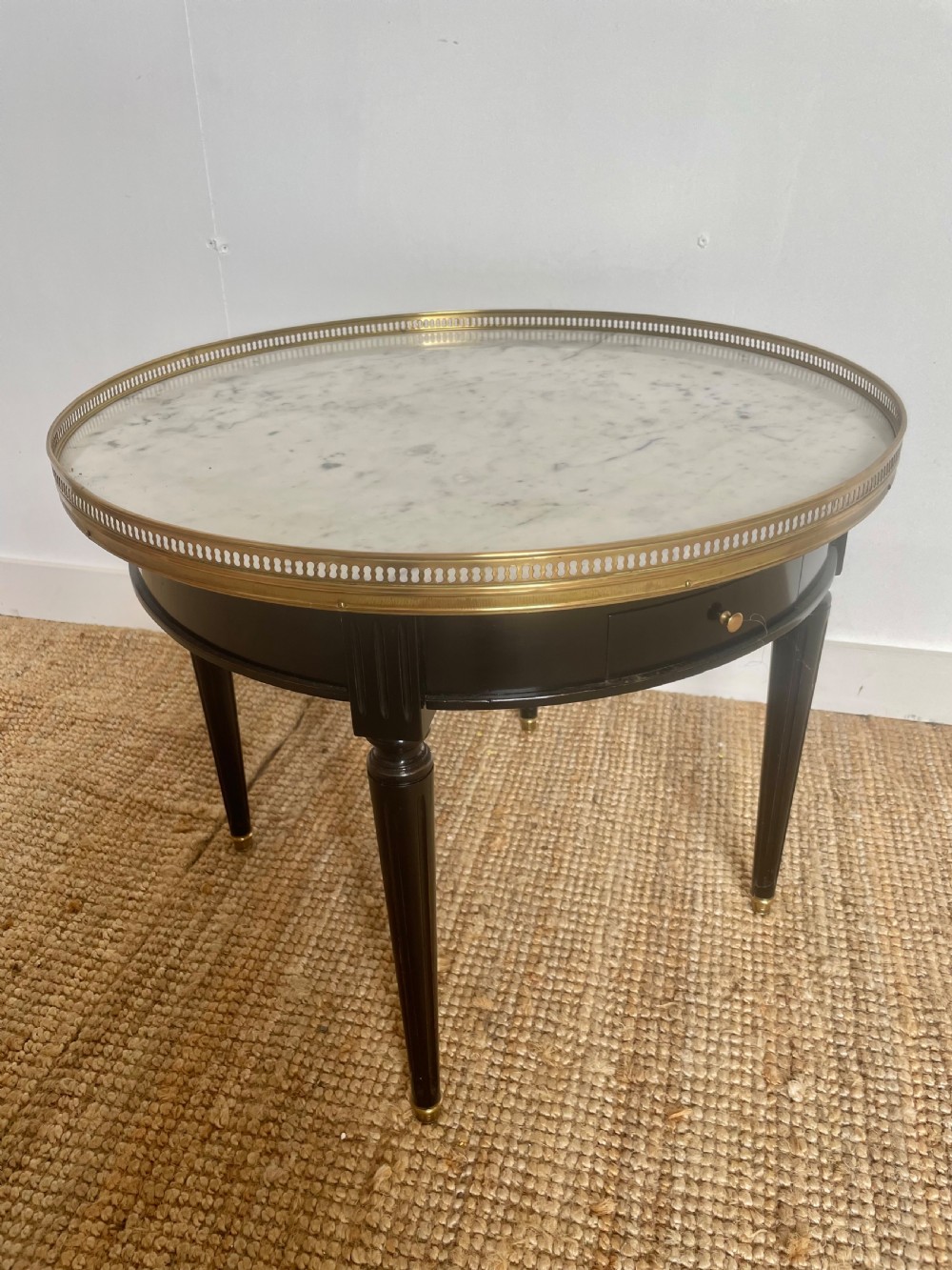 Small round ebonised coffee table