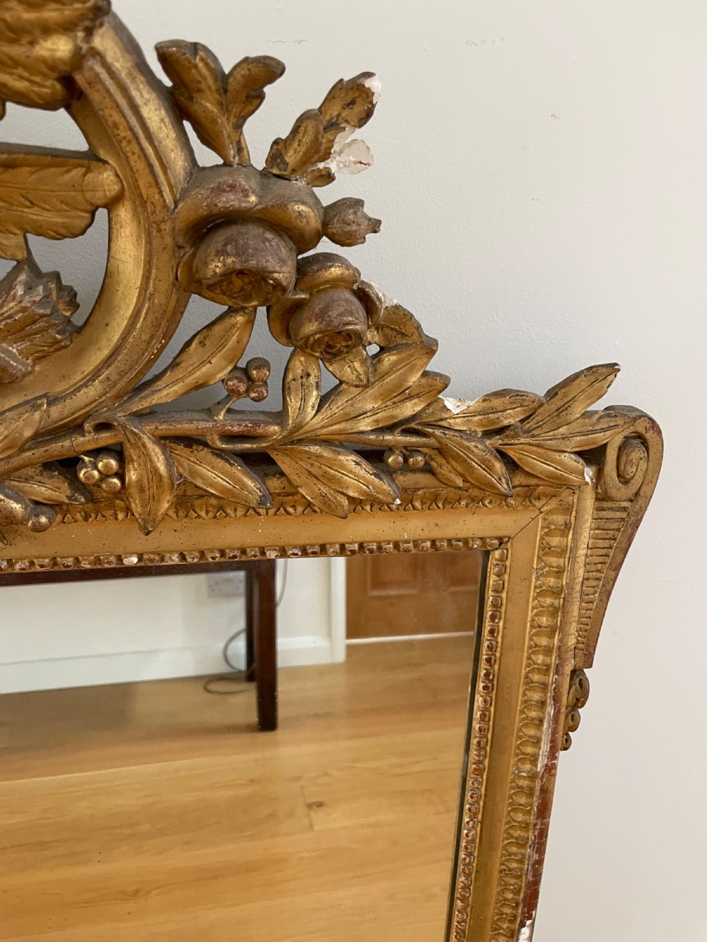 Gilt mirror, with ornate cresting  View V