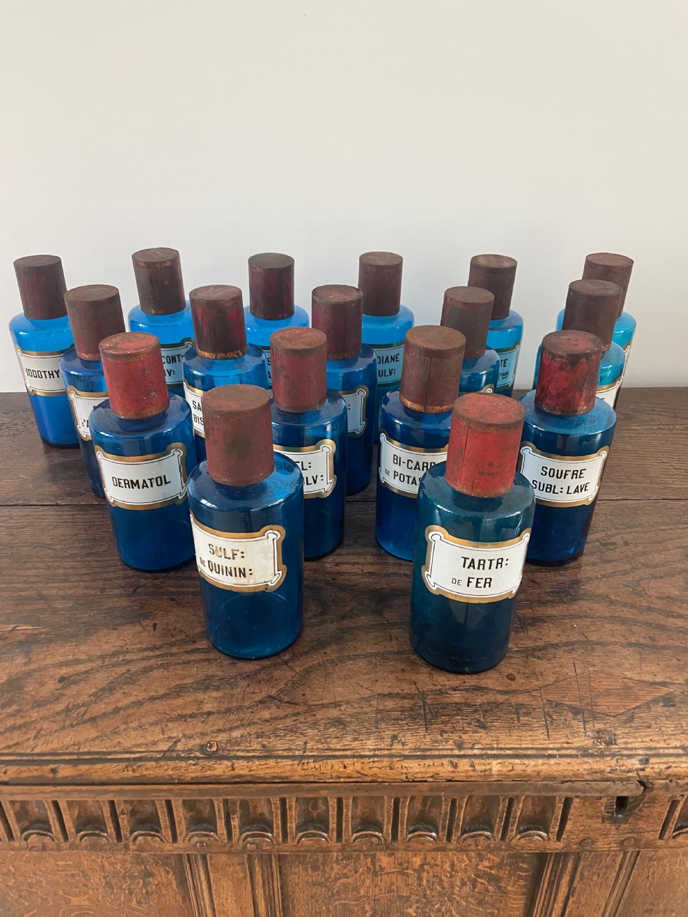 Collection of 17 apothecary bottles 