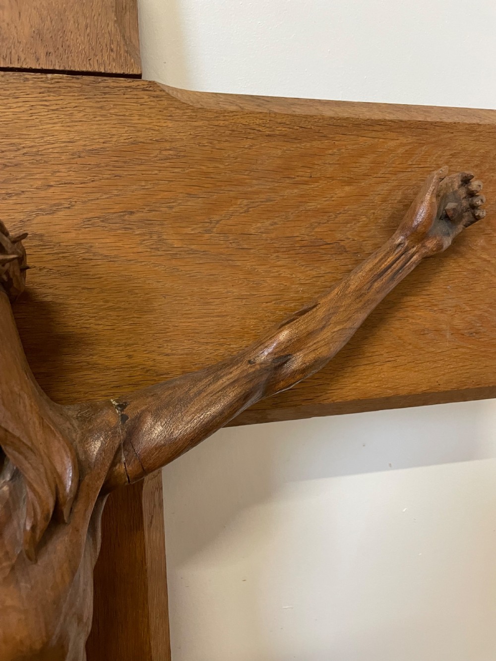 A large Art Deco style carved oak crucifix featuring a detailed wooden figure of Jesus Christ mounted on a broad-armed cross. View IV