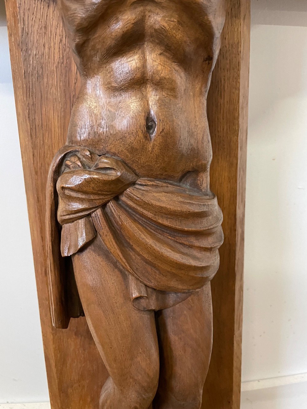 A large Art Deco style carved oak crucifix featuring a detailed wooden figure of Jesus Christ mounted on a broad-armed cross. View VI