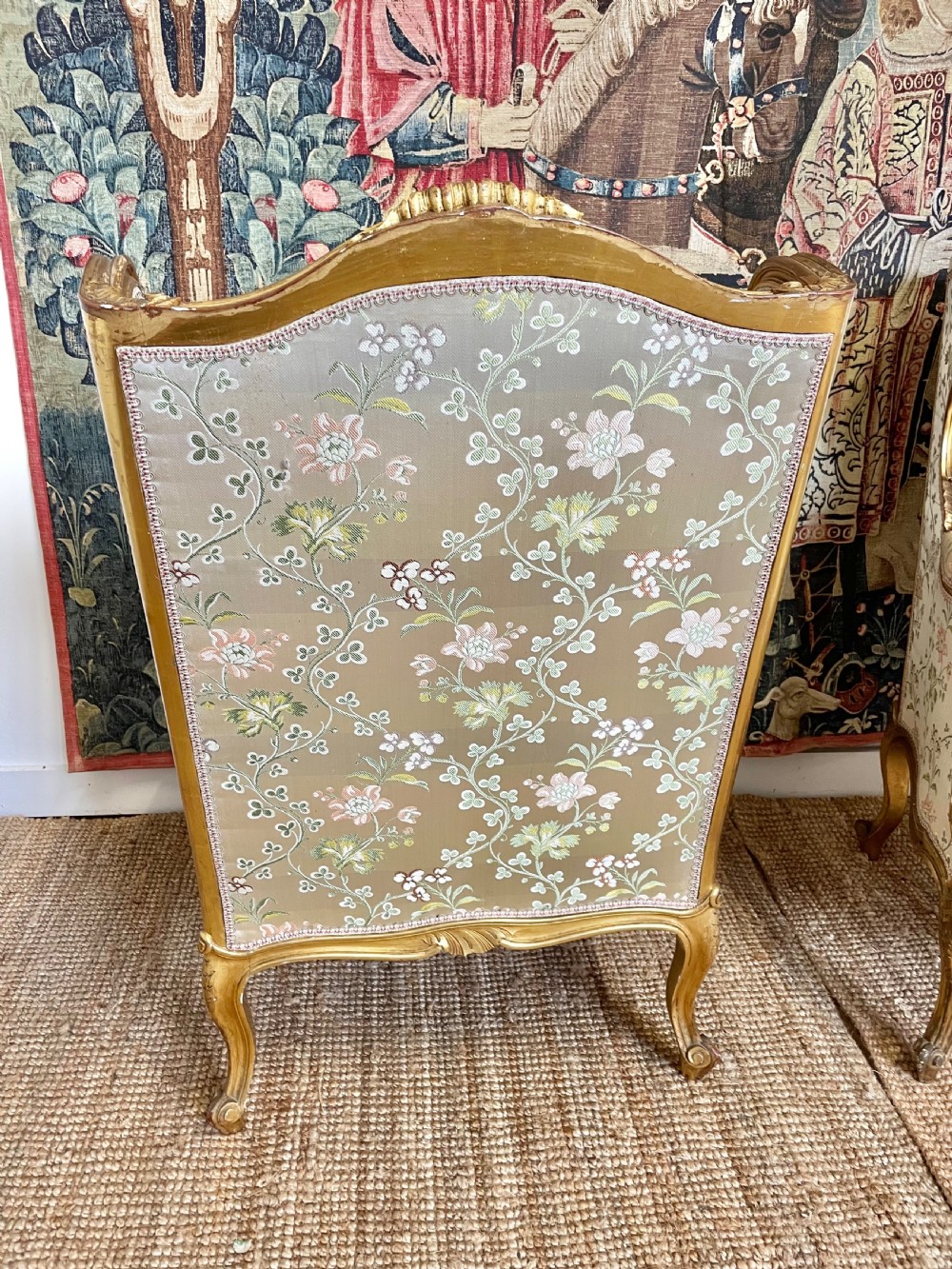 A pair of carved gilt wood fauteuil armchairs upholstered in patterned floral silk fabric. View VIII