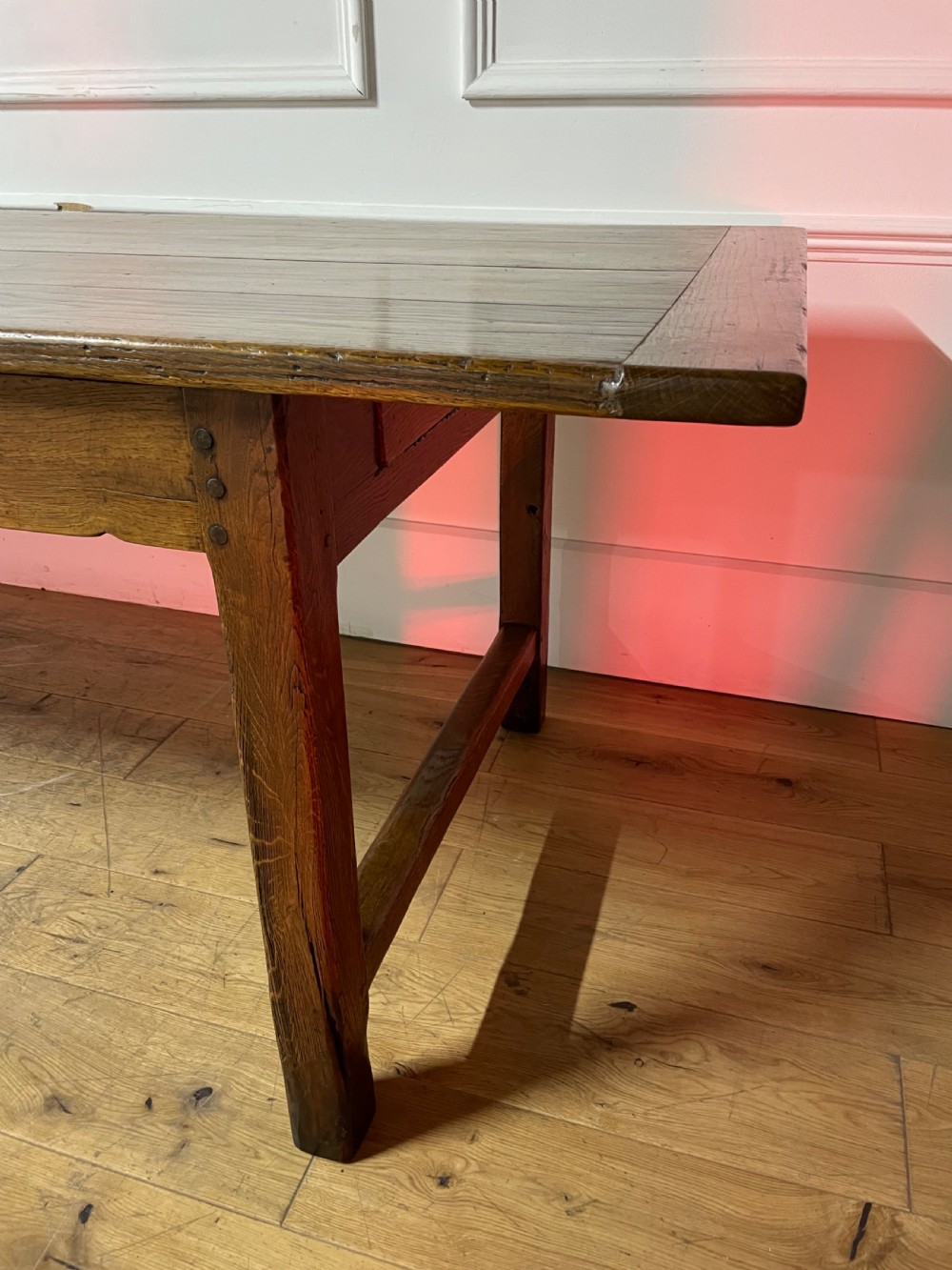 A long, antique oak farmhouse dining table featuring a planked timber top and straight wooden legs joined by side stretchers. View VIII