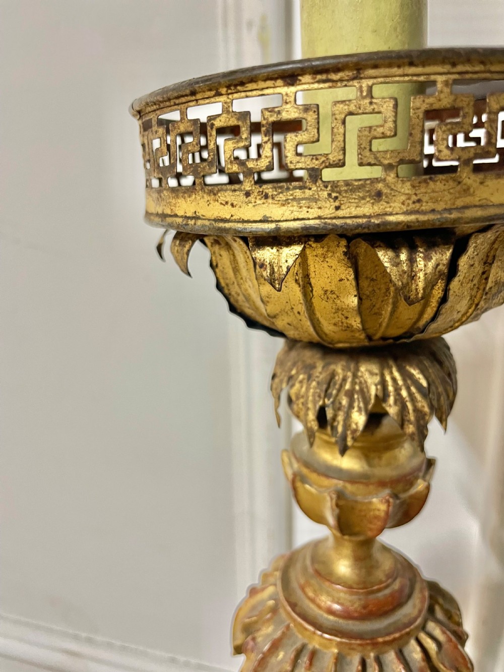A tall Italian giltwood table lamp styled as a candlestick with acanthus leaf carvings, a fluted stem, and a faux candle sleeve. View IV