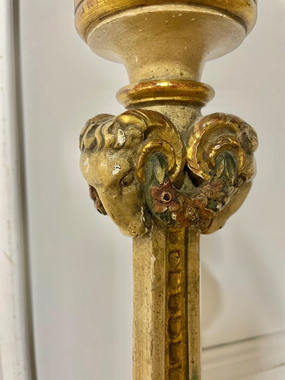 A tall, carved giltwood and cream painted table lamp base featuring neoclassical scrollwork and floral swags. View III