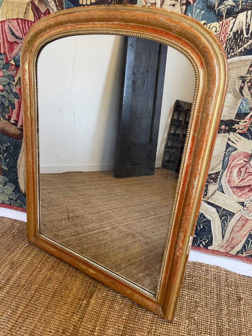 Arched top gilded over mantle mirror 