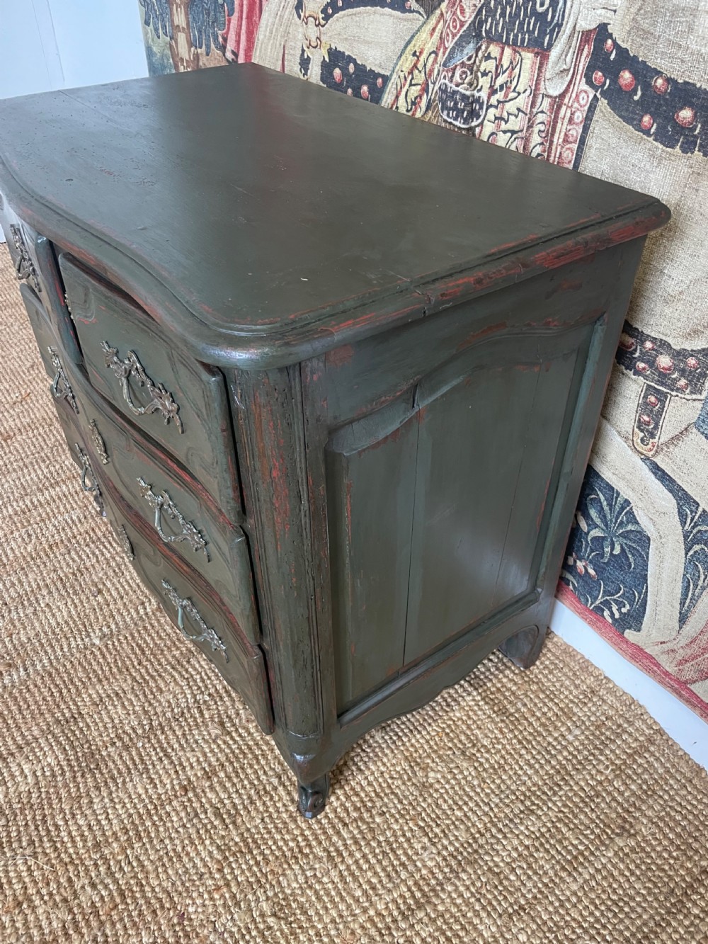 A dark green painted French commode chest of drawers featuring moulded panels, distressed finish, and decorative brass handles. View IX
