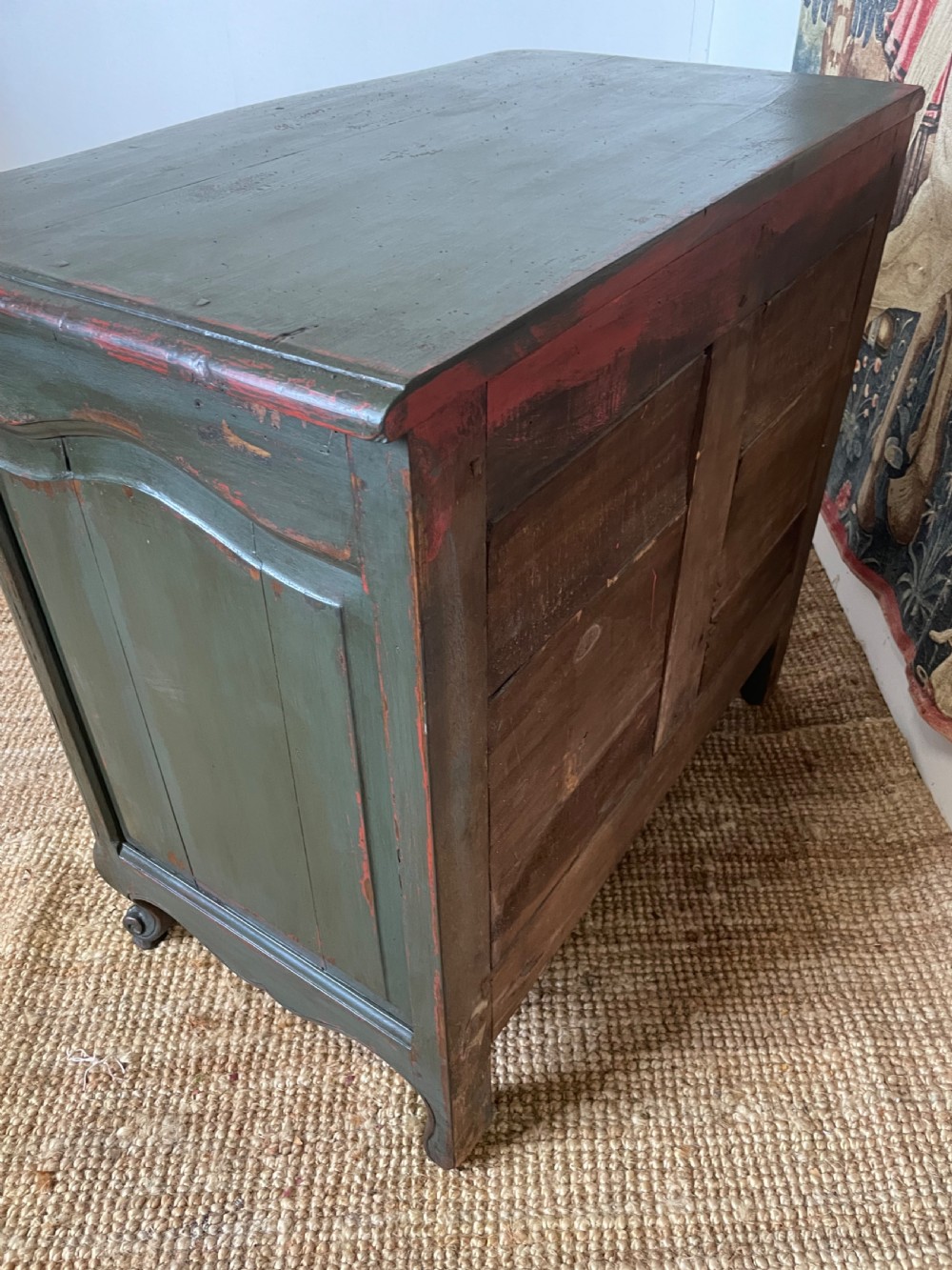 A dark green painted French commode chest of drawers featuring moulded panels, distressed finish, and decorative brass handles. View XI