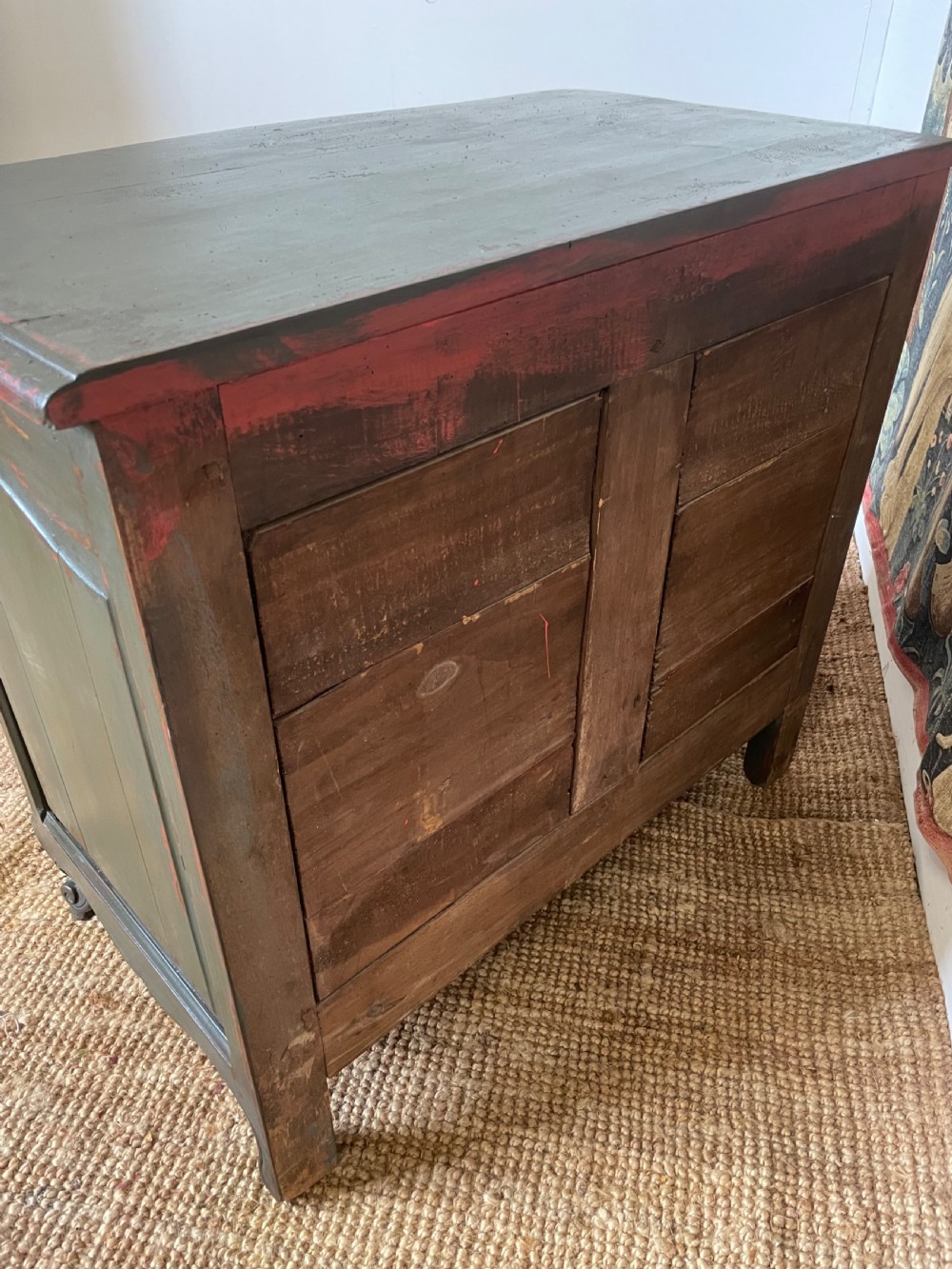 A dark green painted French commode chest of drawers featuring moulded panels, distressed finish, and decorative brass handles. View XII