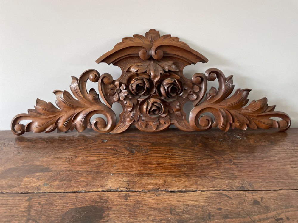 Carved walnut pediment 