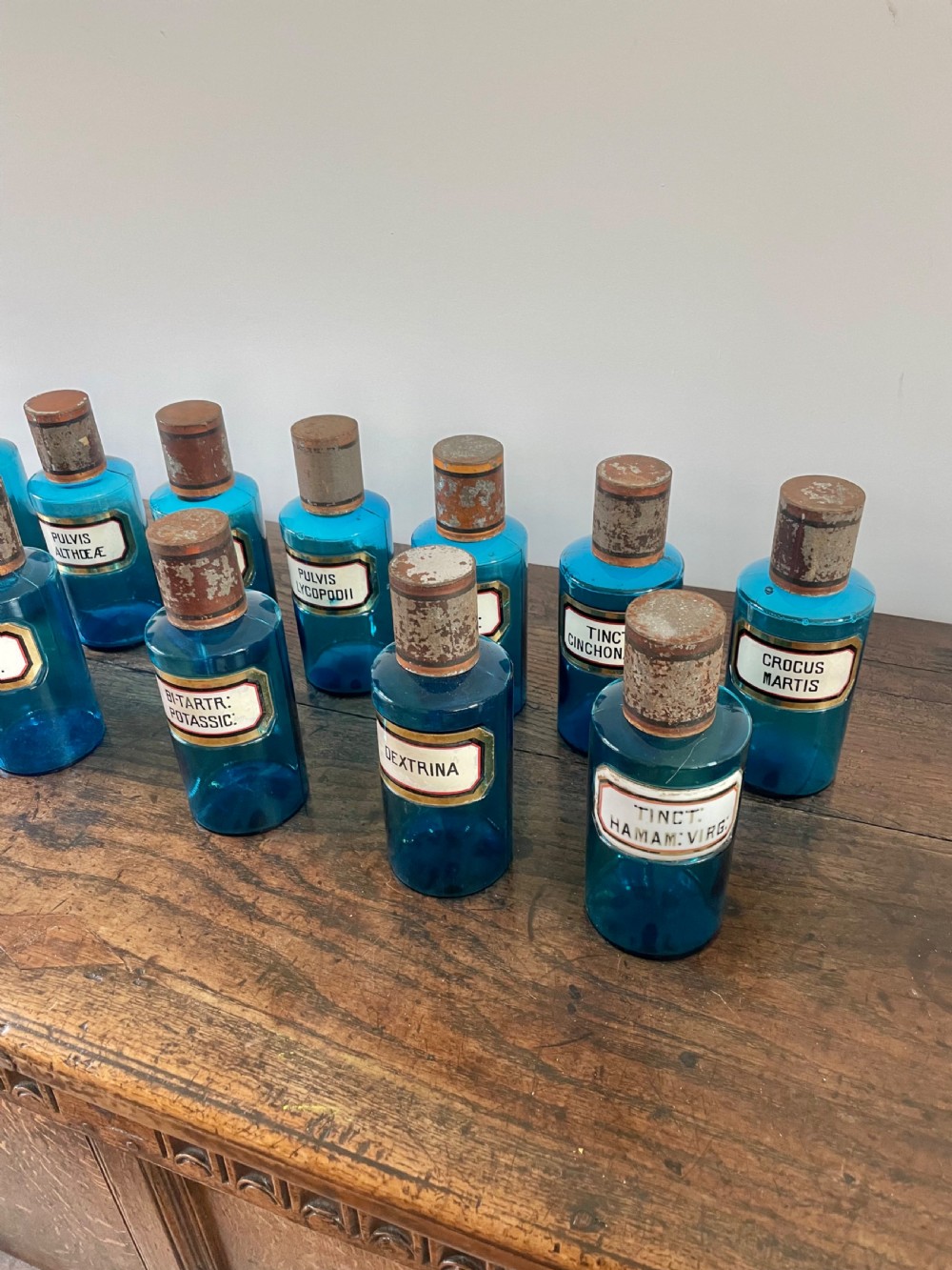 Collection of 13 Blue glass apothecary bottles  View II
