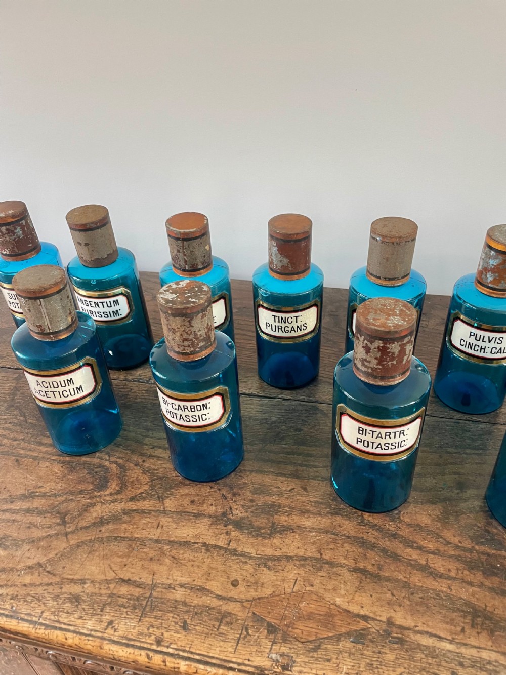 Collection of 13 Blue glass apothecary bottles  View III