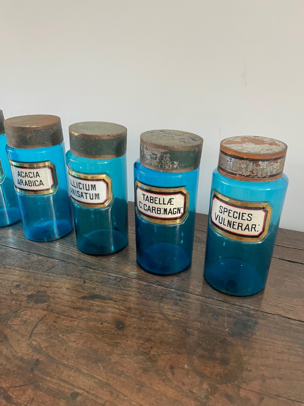 Collection of 11 blue glass apothecary bottles  View III
