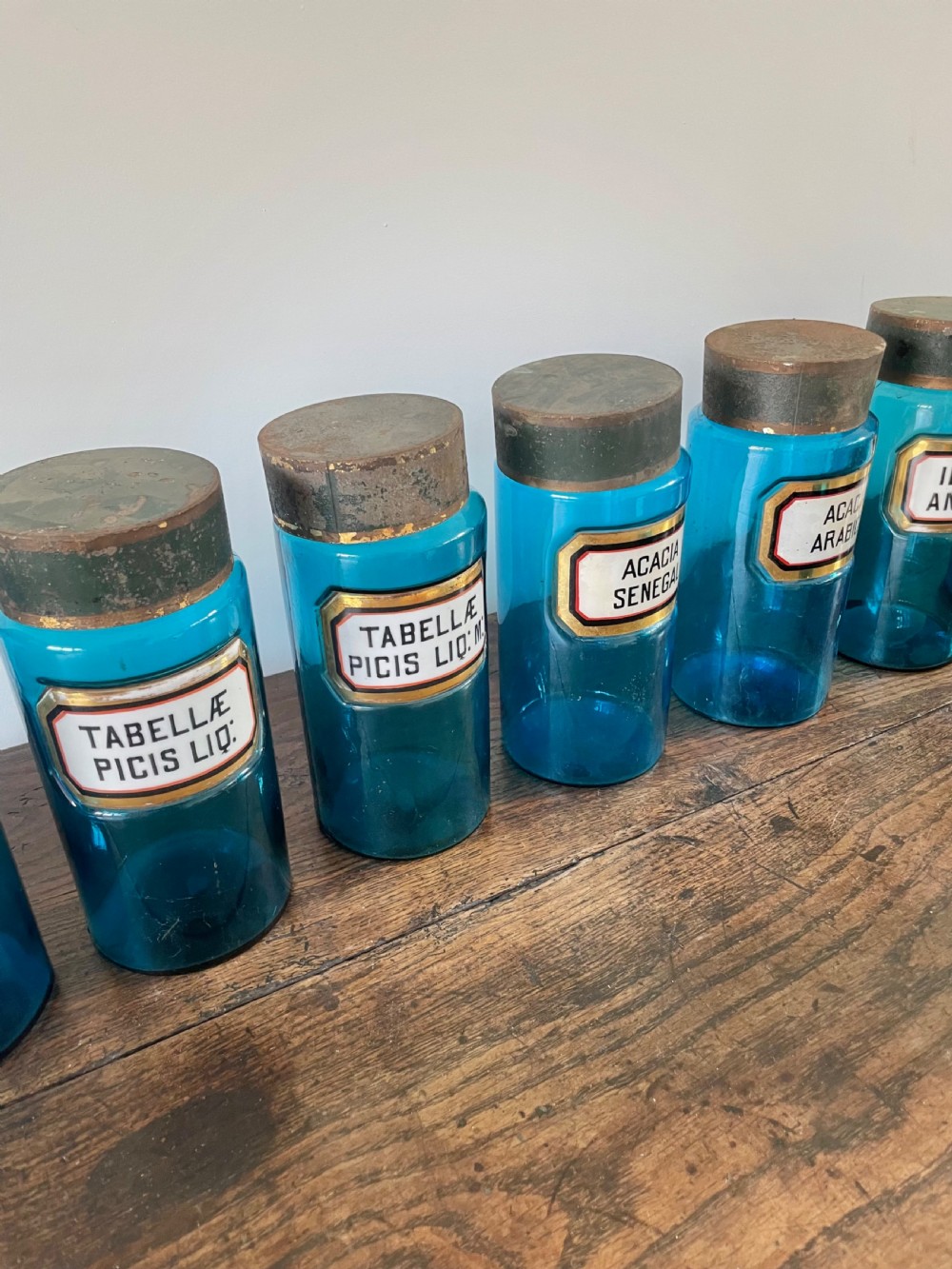 Collection of 11 blue glass apothecary bottles  View V
