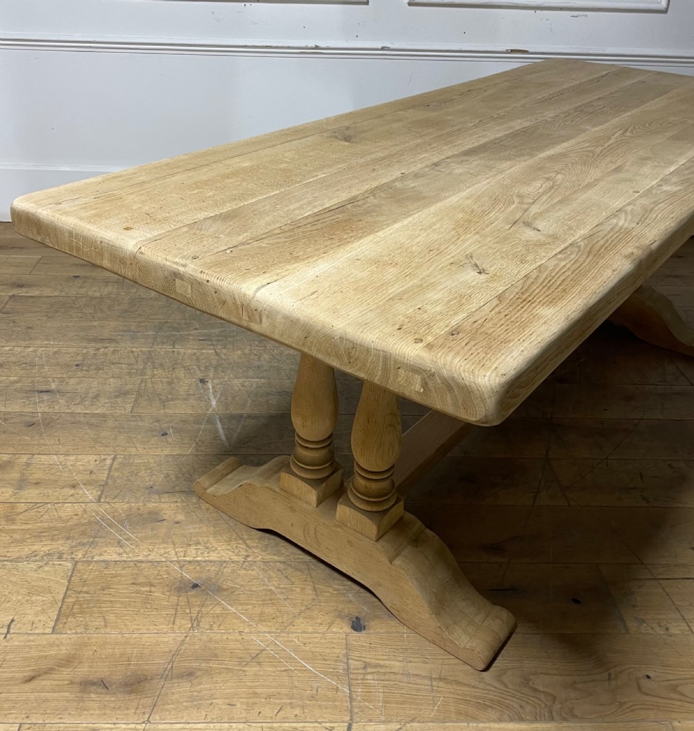 A long rectangular scrubbed oak refectory table featuring turned pedestal supports and a central stretcher. View VIII