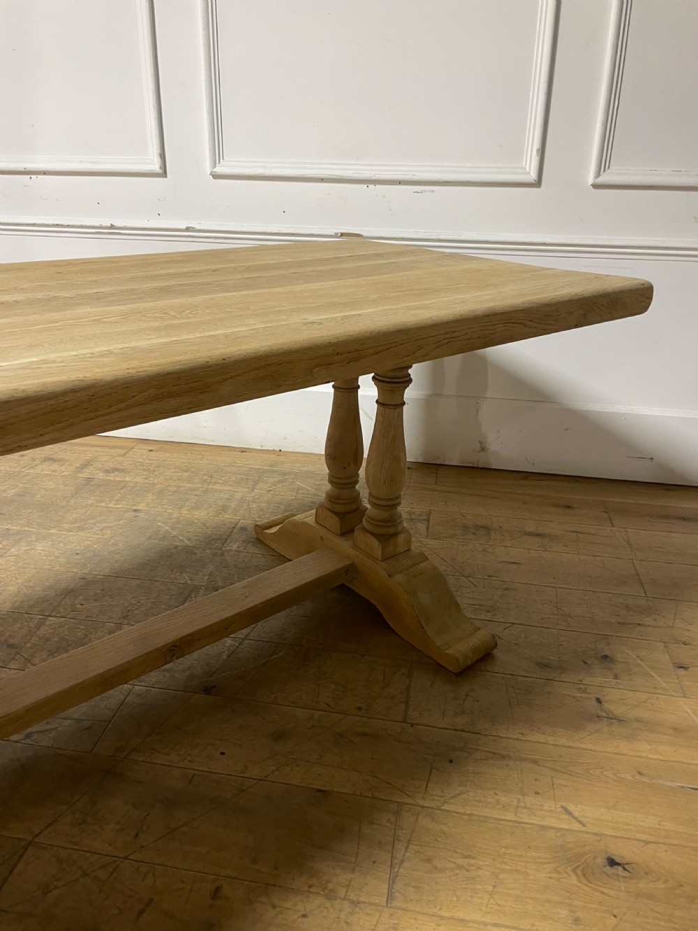 A long rectangular scrubbed oak refectory table featuring turned pedestal supports and a central stretcher. View XIII