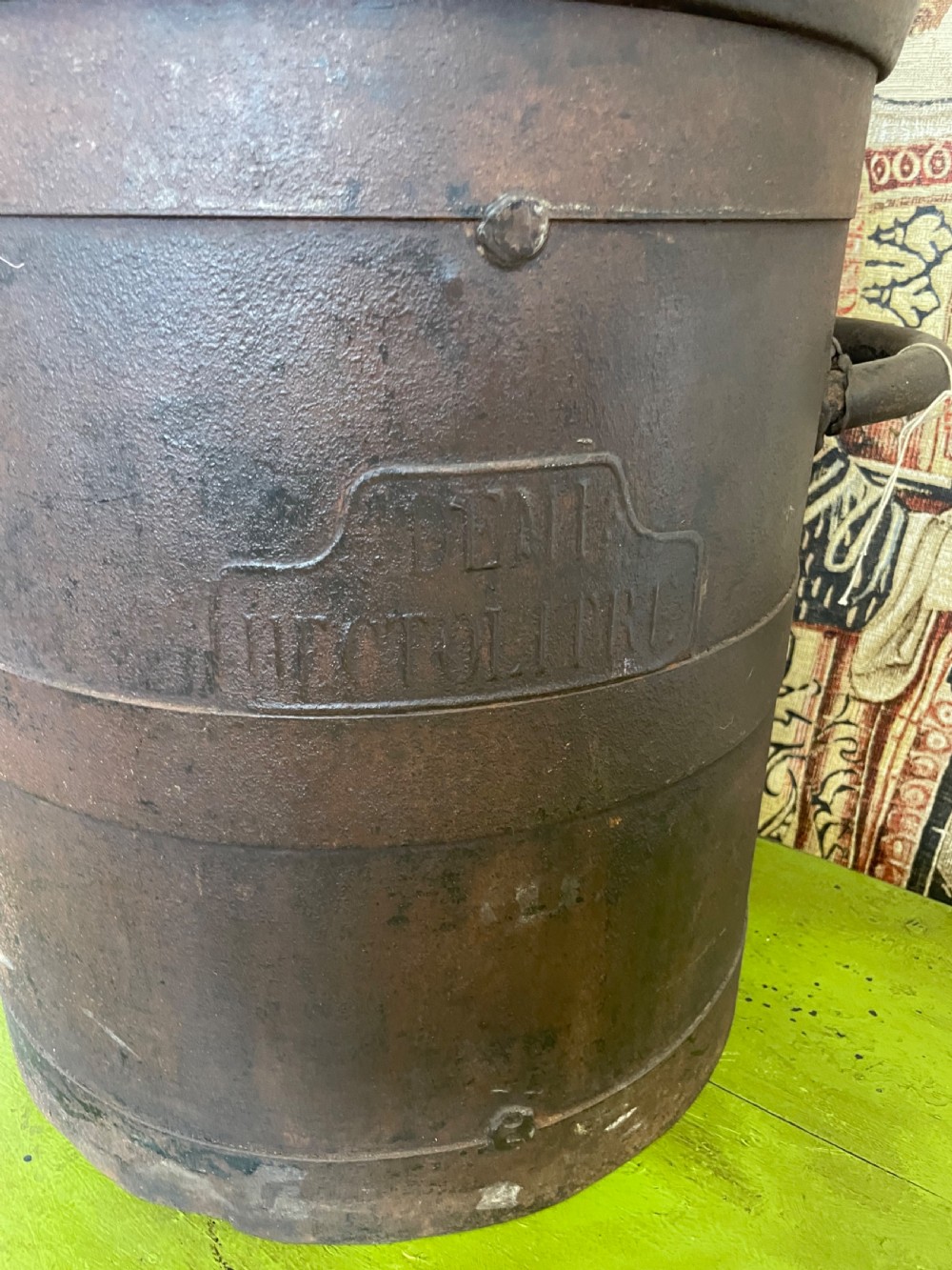 A heavy dark iron industrial measure vessel featuring double side handles, a contoured upper spout, and a patinated metal surface. View II