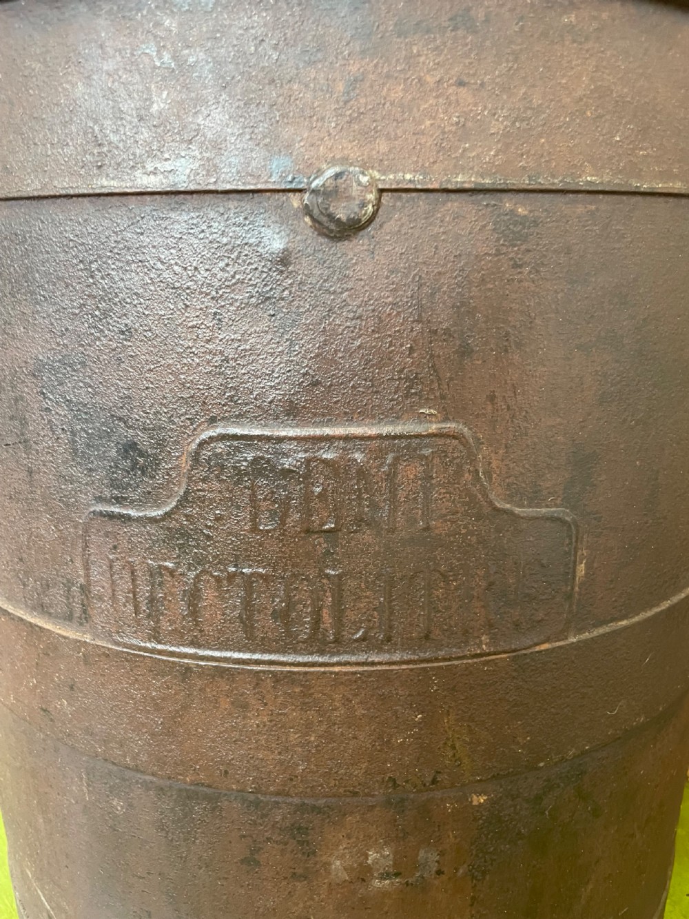 A heavy dark iron industrial measure vessel featuring double side handles, a contoured upper spout, and a patinated metal surface. View III