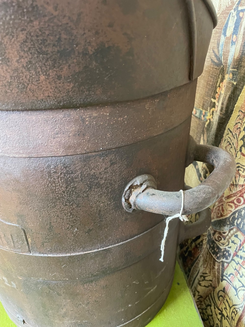 A heavy dark iron industrial measure vessel featuring double side handles, a contoured upper spout, and a patinated metal surface. View V