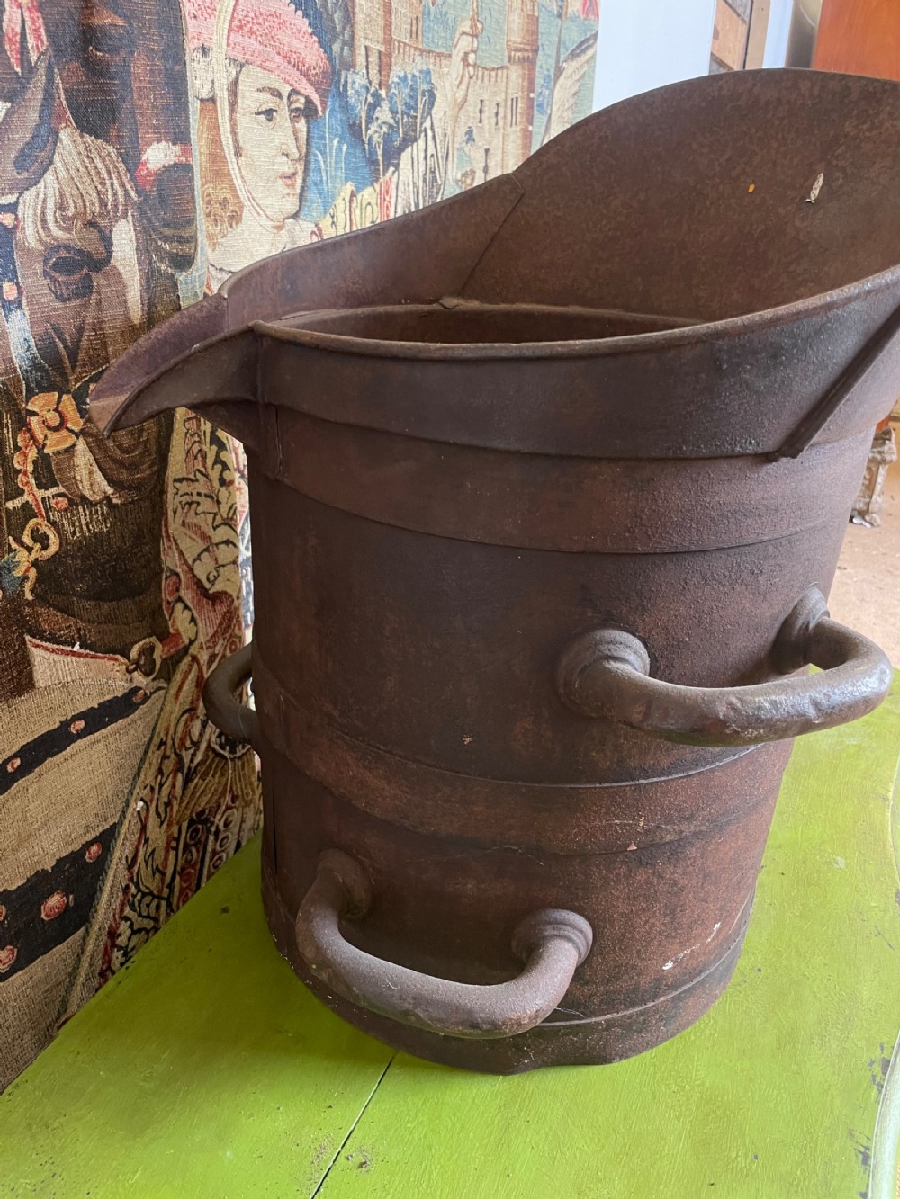 A heavy dark iron industrial measure vessel featuring double side handles, a contoured upper spout, and a patinated metal surface. View VI