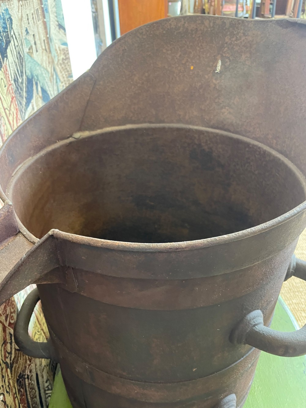 A heavy dark iron industrial measure vessel featuring double side handles, a contoured upper spout, and a patinated metal surface. View VII