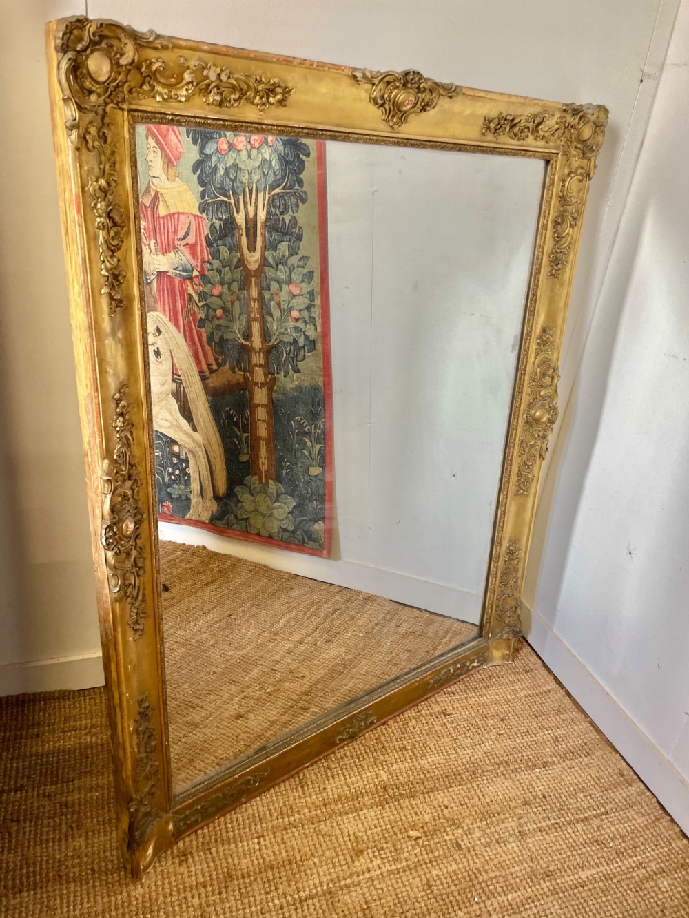 A large early 19th-century rectangular overmantle mirror with a detailed gold leaf frame featuring carved acanthus motifs and a central crest. View II
