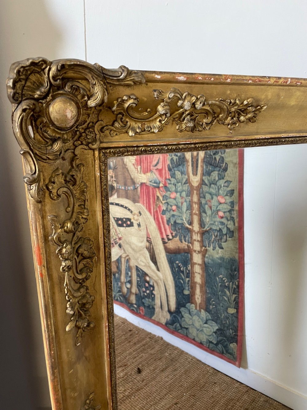 A large early 19th-century rectangular overmantle mirror with a detailed gold leaf frame featuring carved acanthus motifs and a central crest. View III
