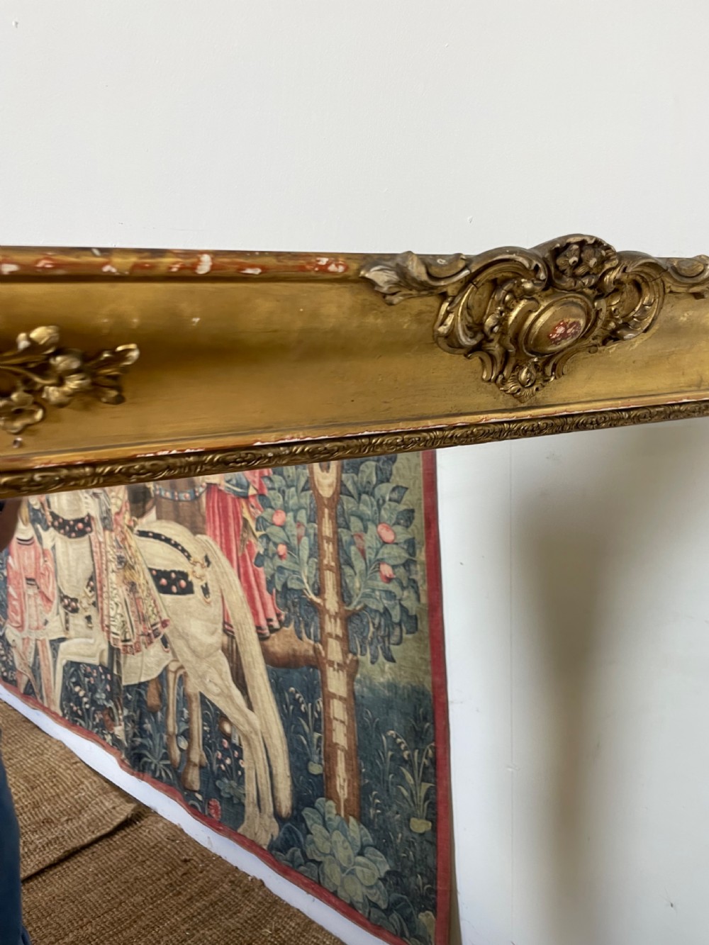 A large early 19th-century rectangular overmantle mirror with a detailed gold leaf frame featuring carved acanthus motifs and a central crest. View IV