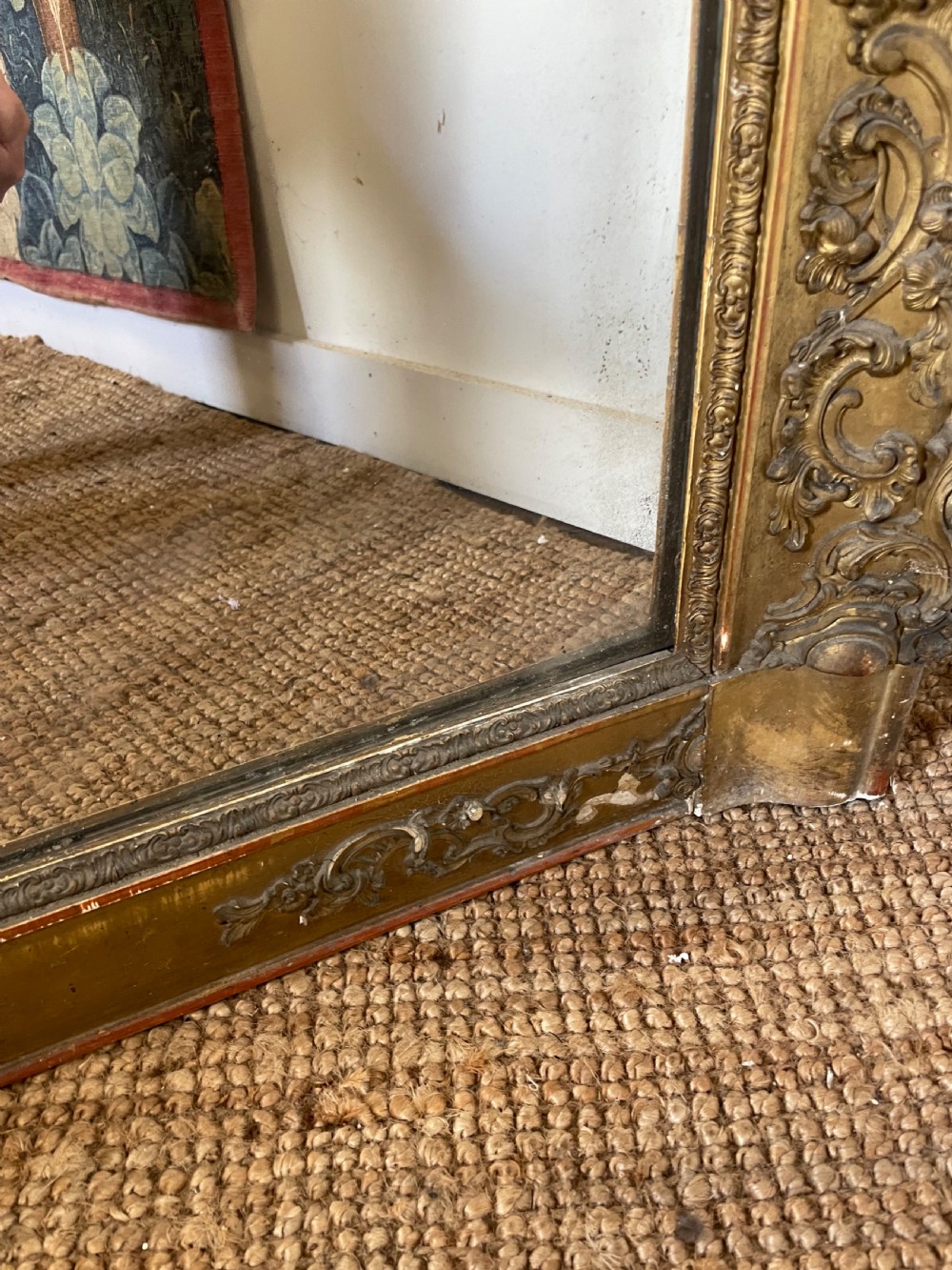 A large early 19th-century rectangular overmantle mirror with a detailed gold leaf frame featuring carved acanthus motifs and a central crest. View VIII