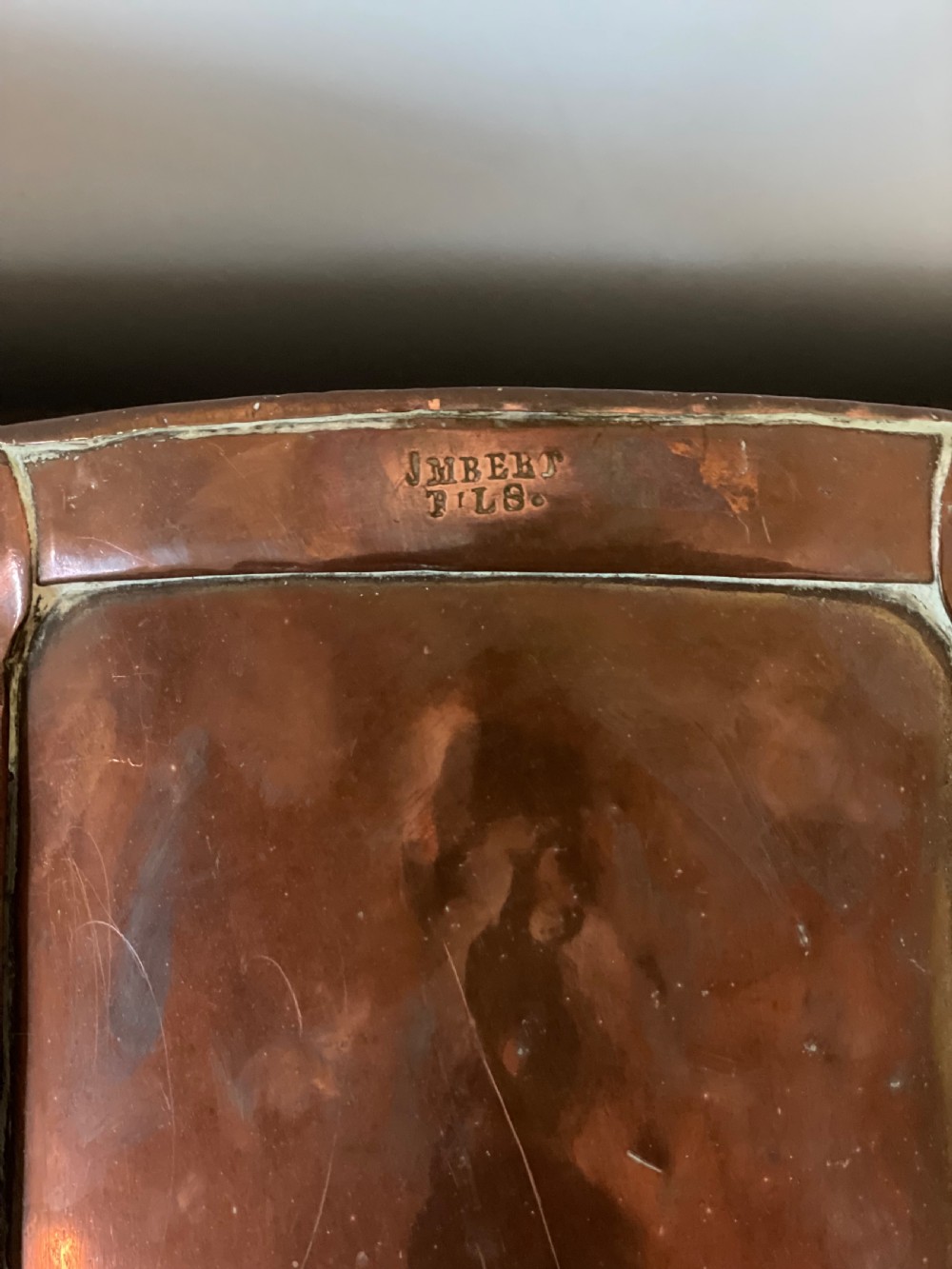 A 19th-century French cylindrical copper bucket featuring riveted vertical reinforcing bands, dual side handles, and a stamped makers mark. View IX