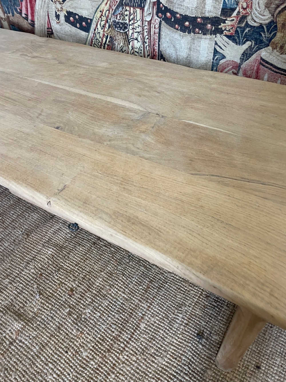 A long light oak farmhouse table featuring a rectangular plank top, two frieze drawers with dark metal handles, and square legs joined by a low stretcher. View VIII