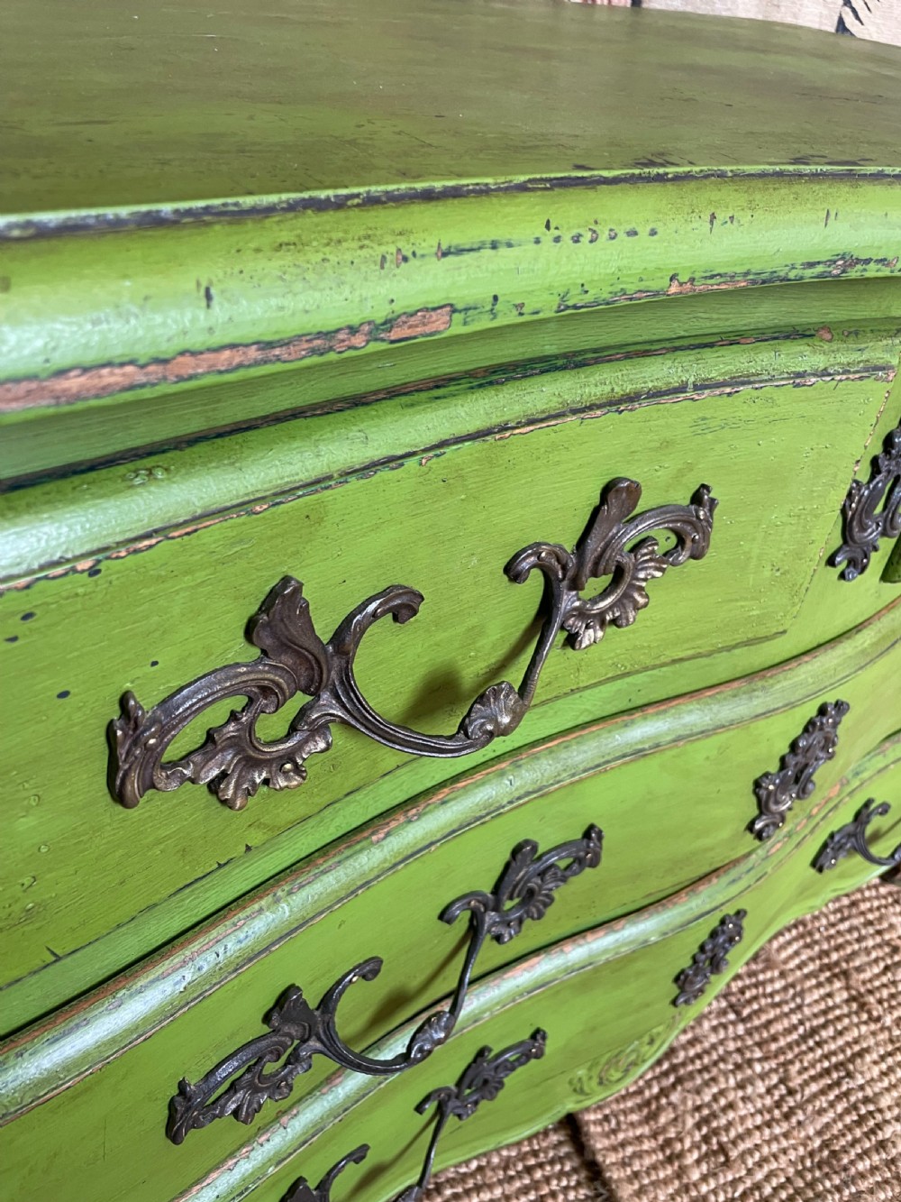 A green painted wooden commode chest of drawers featuring curved cabriole legs and brass hardware. View XIV