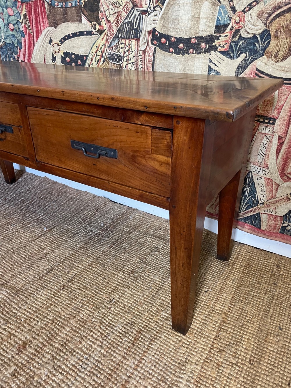 A rectangular cherrywood dresser base featuring three drawers with metal drop handles and straight tapered legs. View II