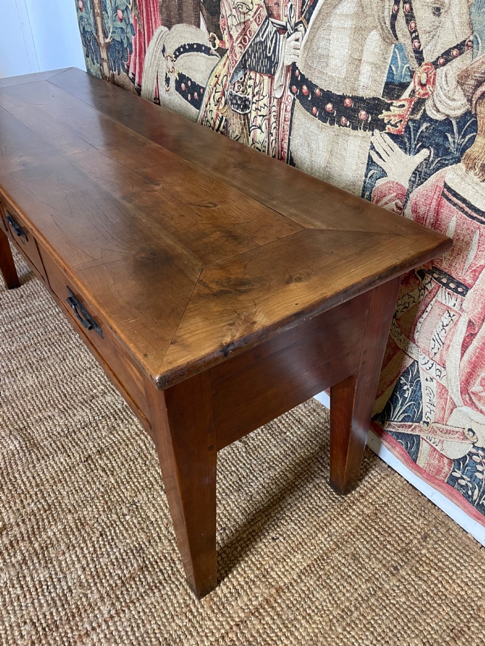 A rectangular cherrywood dresser base featuring three drawers with metal drop handles and straight tapered legs. View III