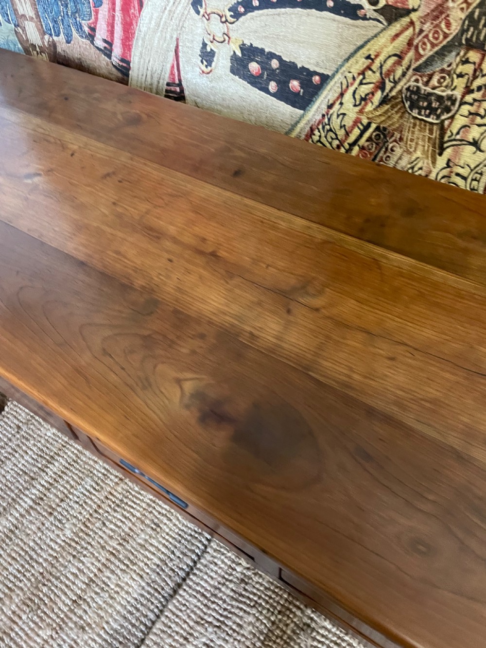 A rectangular cherrywood dresser base featuring three drawers with metal drop handles and straight tapered legs. View VII