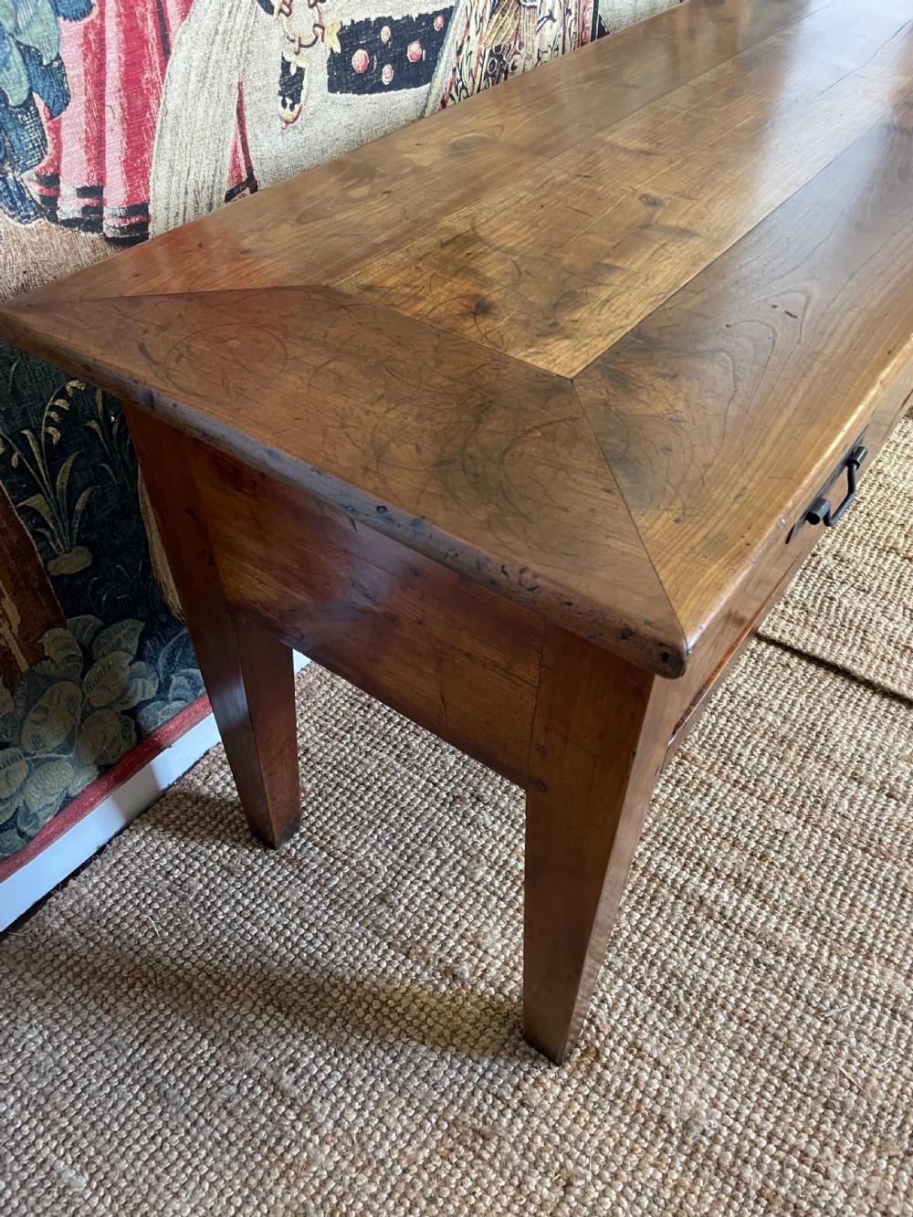 A rectangular cherrywood dresser base featuring three drawers with metal drop handles and straight tapered legs. View IX