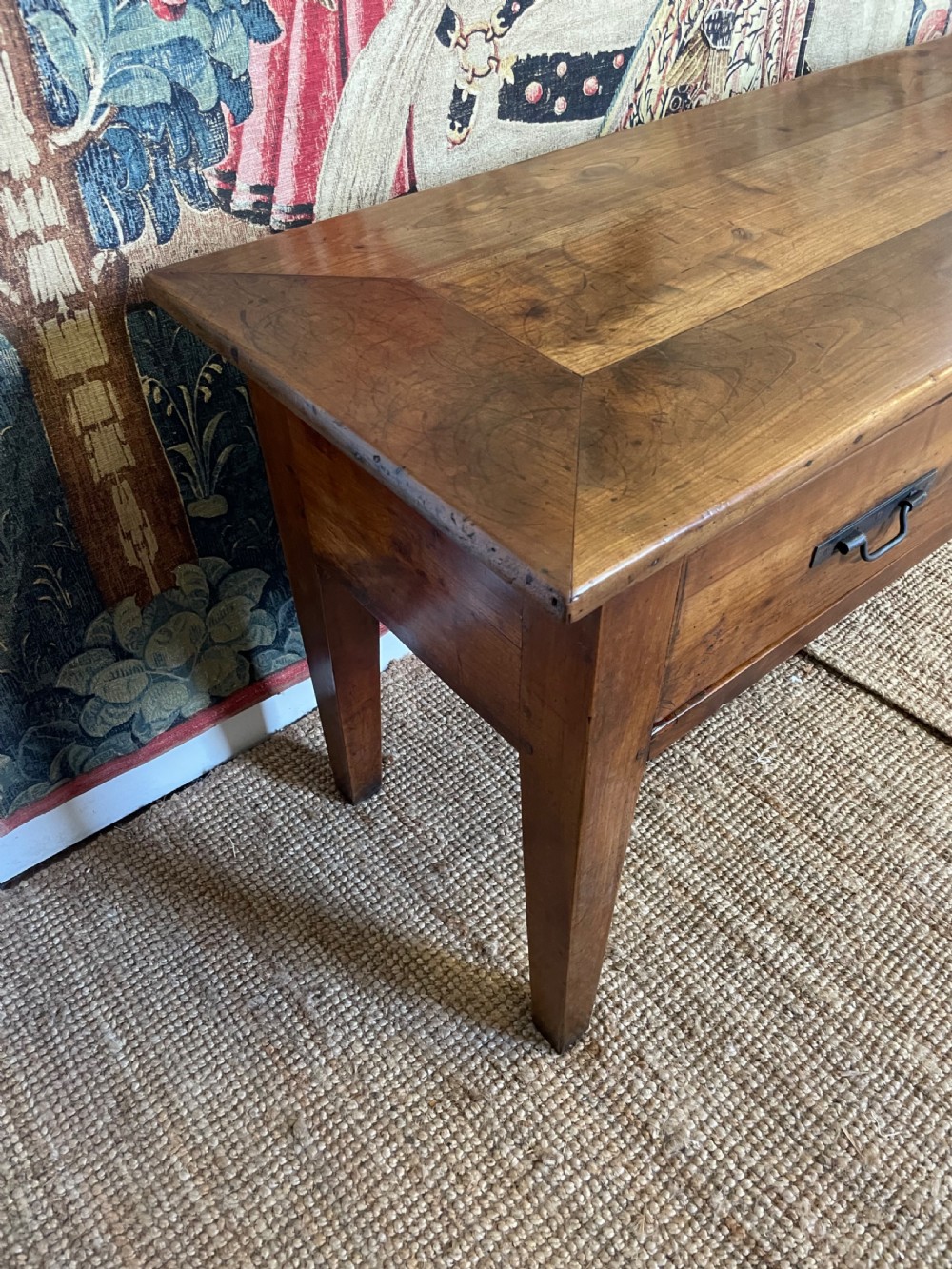 A rectangular cherrywood dresser base featuring three drawers with metal drop handles and straight tapered legs. View X