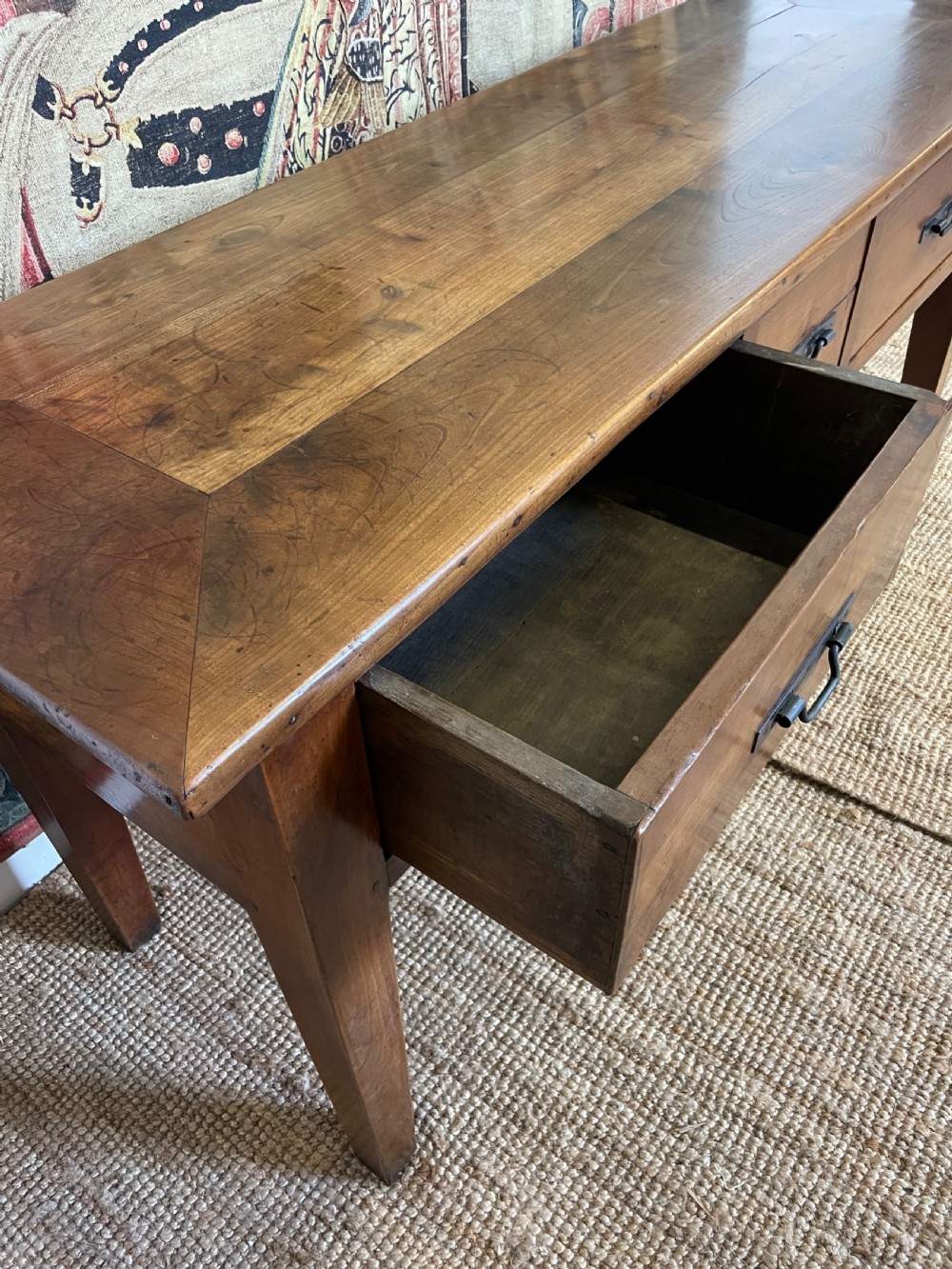 A rectangular cherrywood dresser base featuring three drawers with metal drop handles and straight tapered legs. View XIII