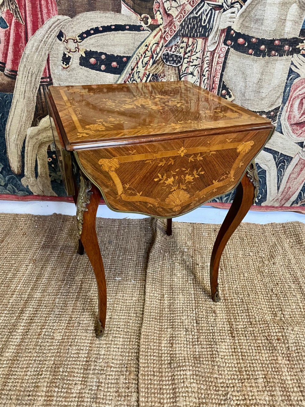 A square French Napoleon III rosewood side table featuring intricate floral marquetry inlay, cabriole legs, and brass mounts.