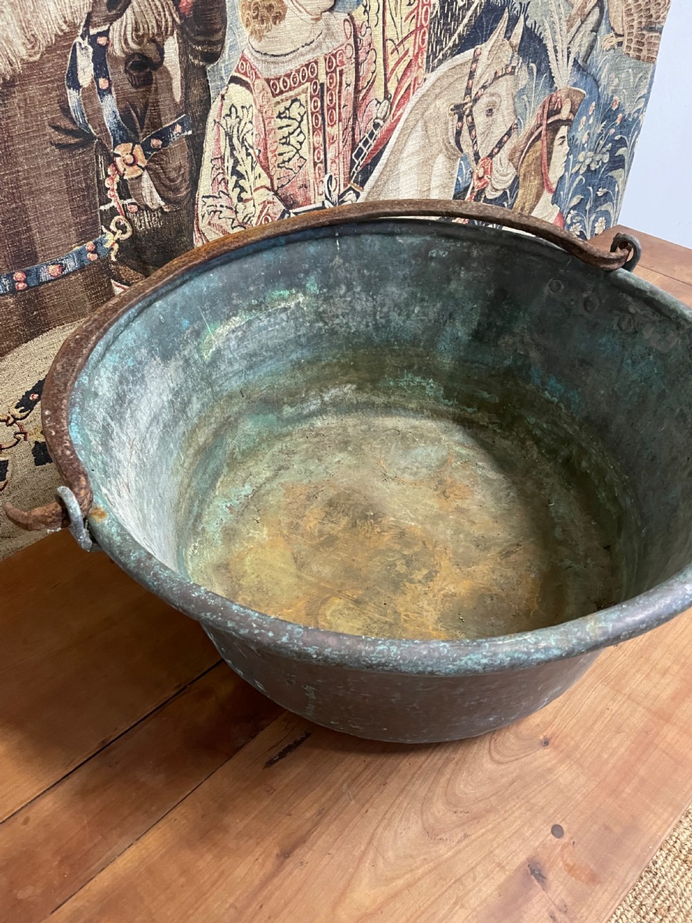 A 19th-century round copper log bin featuring a natural green verdigris patina and a heavy wrought iron swing handle. View IV
