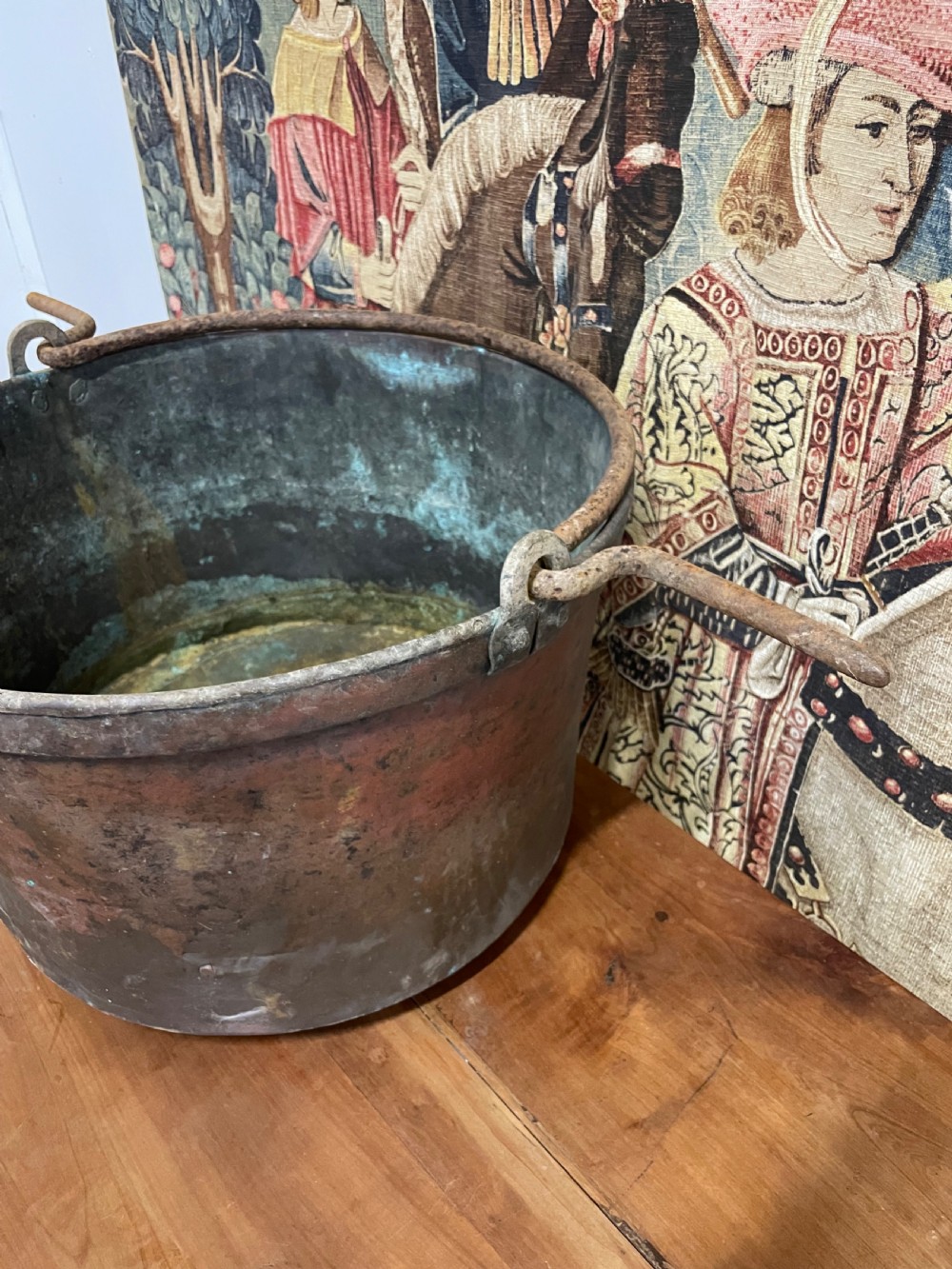 A circular 19th-century copper vessel with a verdigris interior, patinated copper exterior, rolled rim, and wrought iron side handles. View IV