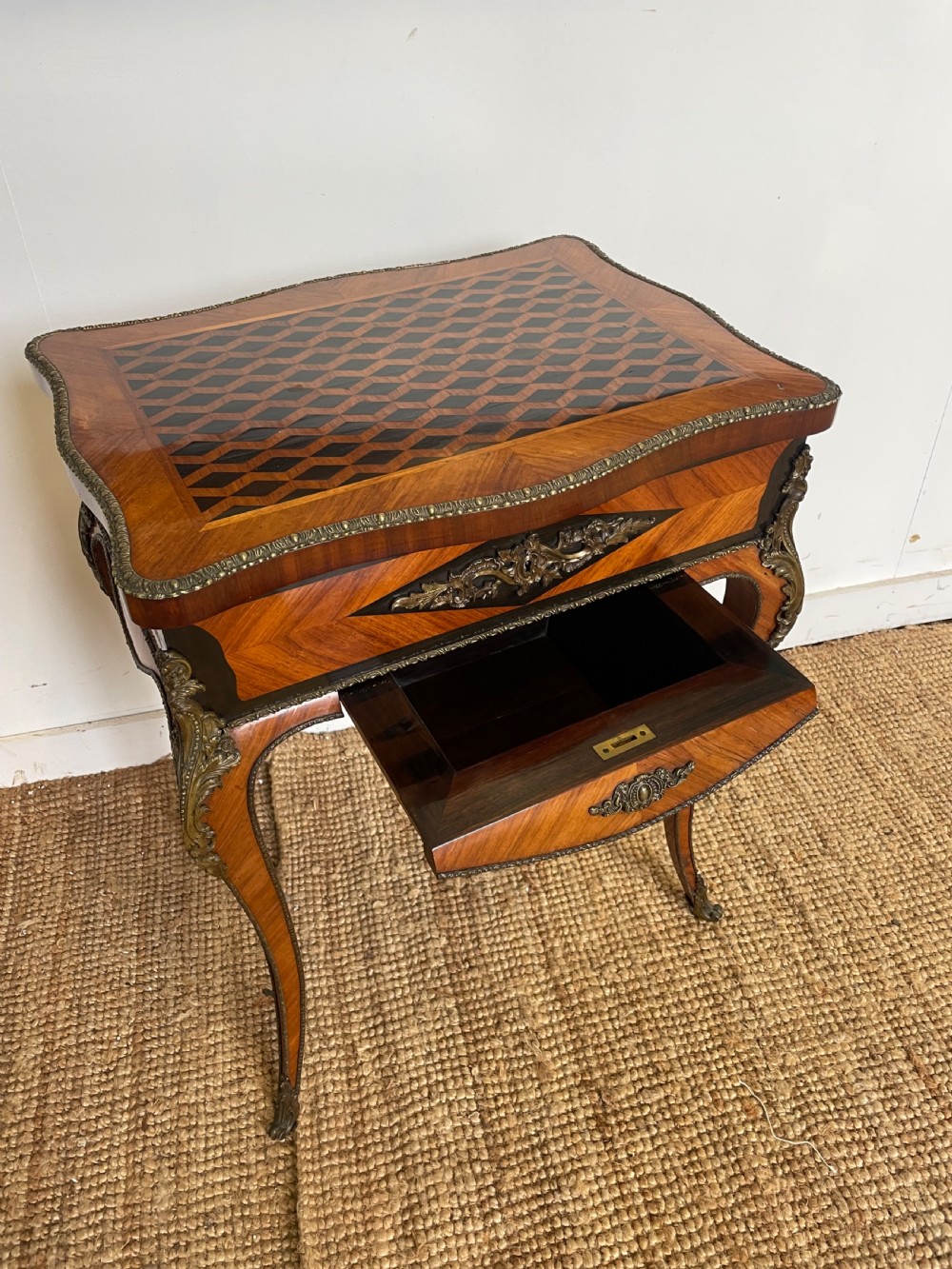 A 19th-century French Napoleon III kingwood worktable featuring parquetry top surface, serpentine cabriole legs, and cast brass mounts. View II