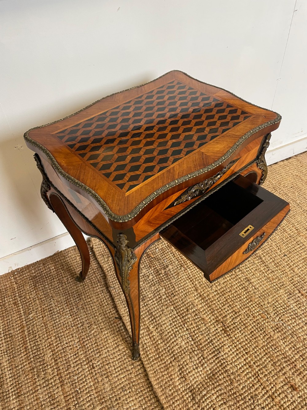 A 19th-century French Napoleon III kingwood worktable featuring parquetry top surface, serpentine cabriole legs, and cast brass mounts. View IV