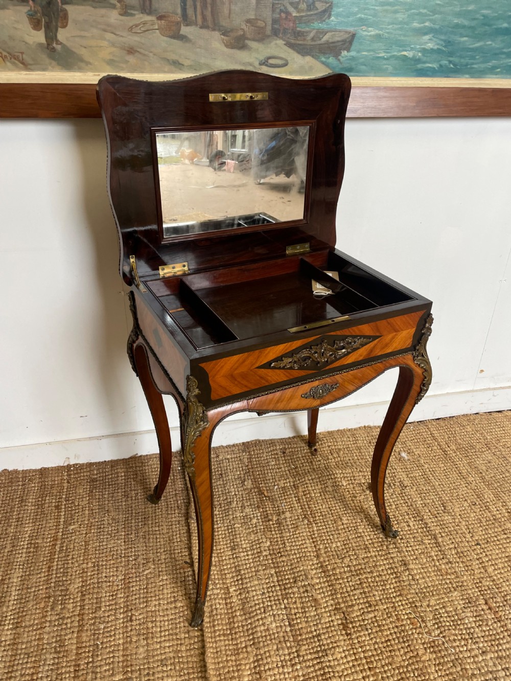 A 19th-century French Napoleon III kingwood worktable featuring parquetry top surface, serpentine cabriole legs, and cast brass mounts. View VI